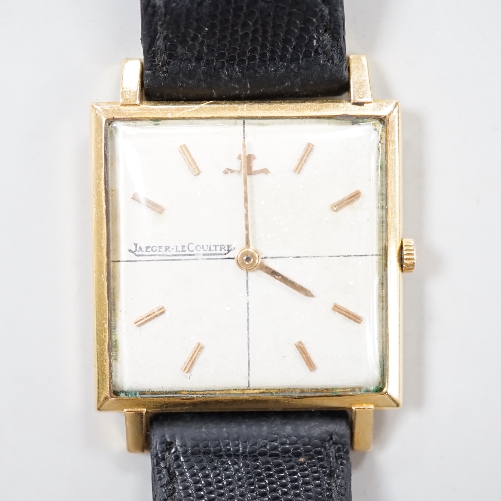 A gentleman's yellow metal (Swiss 750 mark) Jaeger LeCoultre manual wind dress wrist watch, on associated leather strap, no box or papers.